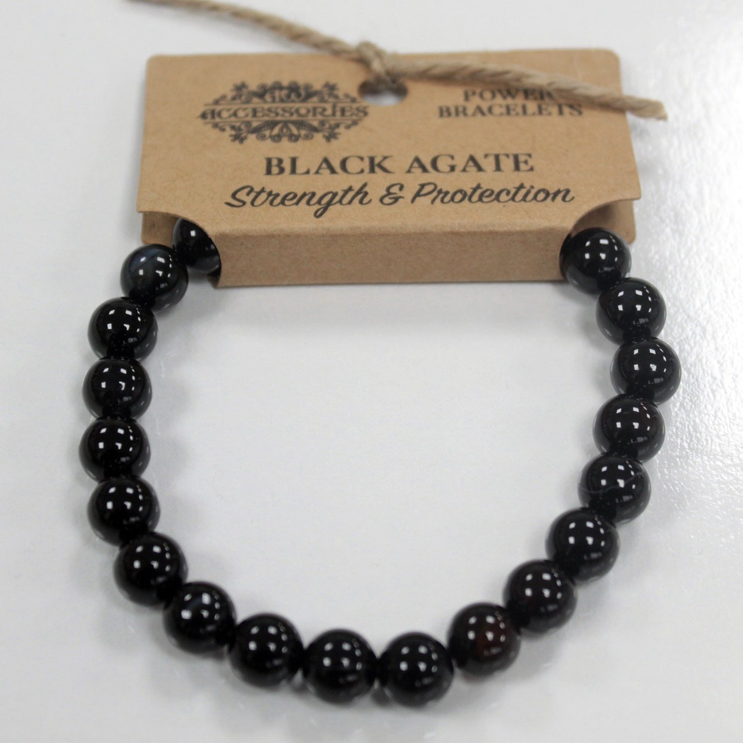 Pulsera brazalete piedras negras de Ágata negra con etiqueta de cartón para colgar en expositor
