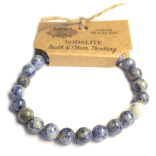 Pulsera brazalete piedras azuladas de sodalita con etiqueta de cartón para colgar en expositor