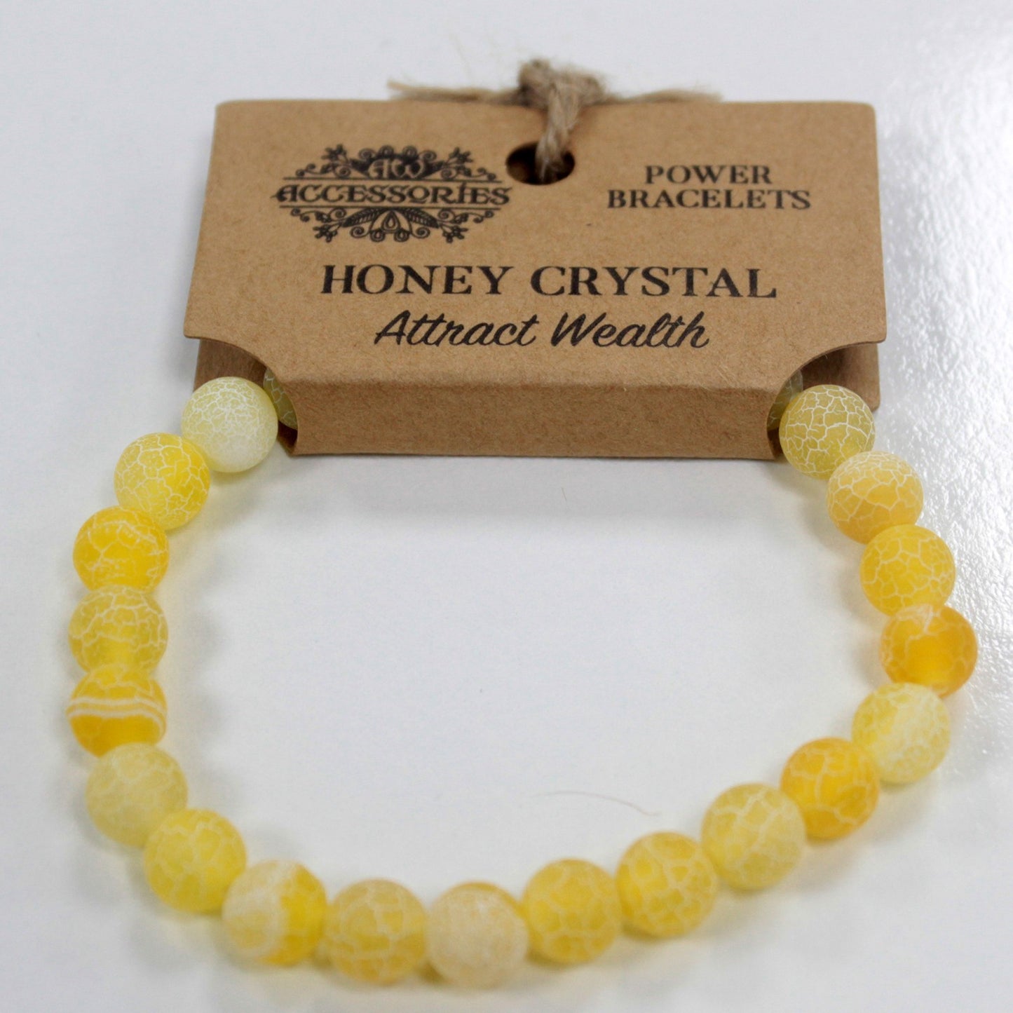 Pulsera brazalete de piedras amarillas de cristal de miel con etiqueta de cartón para colgar en expositor